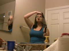 Kilo Sex presents: Pretty brunette babe straightens her hair in front of mirror