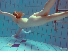 Kilo Sex presents: Redhead goes for a nude swim in the pool