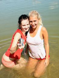 KiloSex presents: Two young girls on the beach start with licking and then..